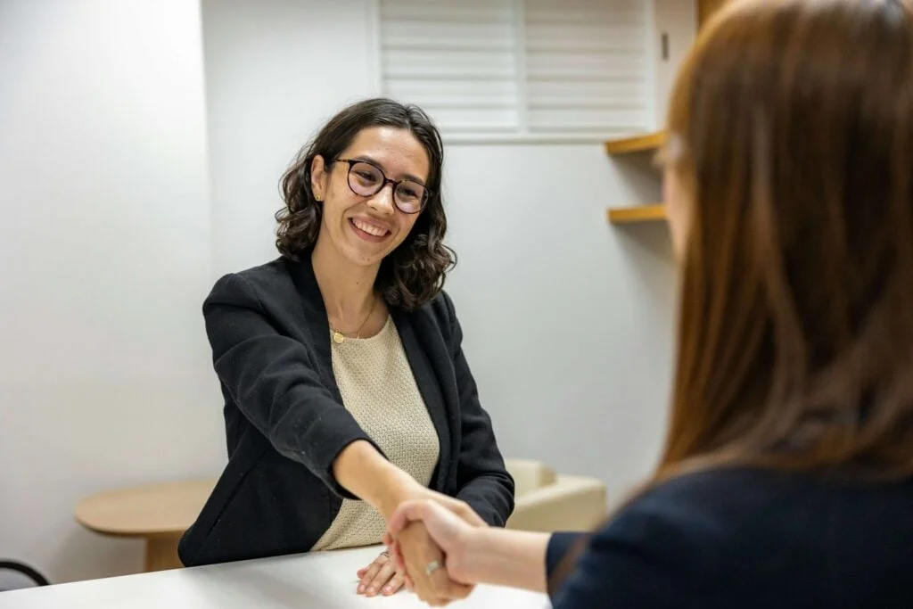 Two people shaking hands, Sengo's recruitment process is built on transparency and respect
